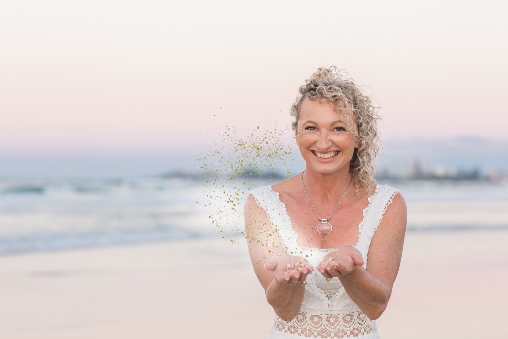 Manifest from your heart, not the ego's need to control. This is a personal image. Co-founder of Reclaim her is surrounded by the cleansing ocean with her palms open and magic emerging from there. This represents manifesting from the heart. This image is both decorative & functional.